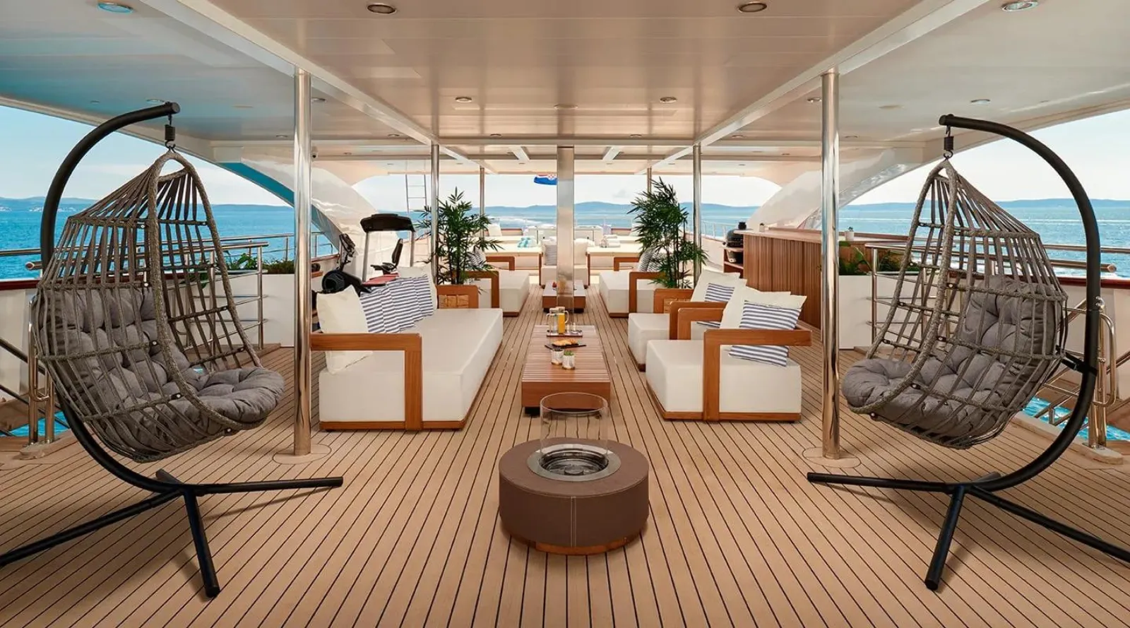 Hanging egg chairs on the upper deck of MY Ohana